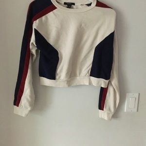 White sweater with dark red and blue detailing